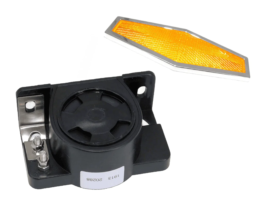 One black external backup alarm and one reflector