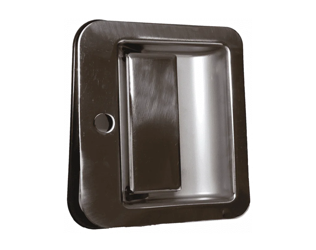 One chrome colored truck door handle.