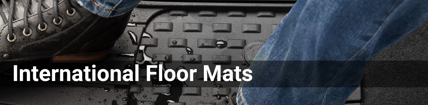 Closeup shot of a boot and a black floor mat. The header is International Floor Mats in white font.