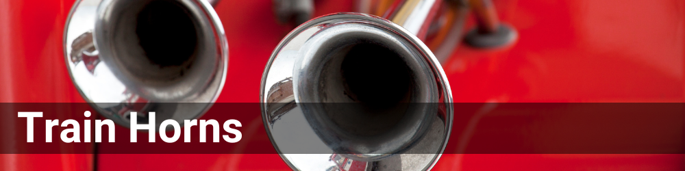 Closeup of two chrome train horns. The header is Train Horns in a white font.